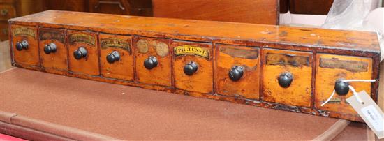 A 19th century apothecarys pine cabinet of small proportions, fitted nine short drawers length 73cm